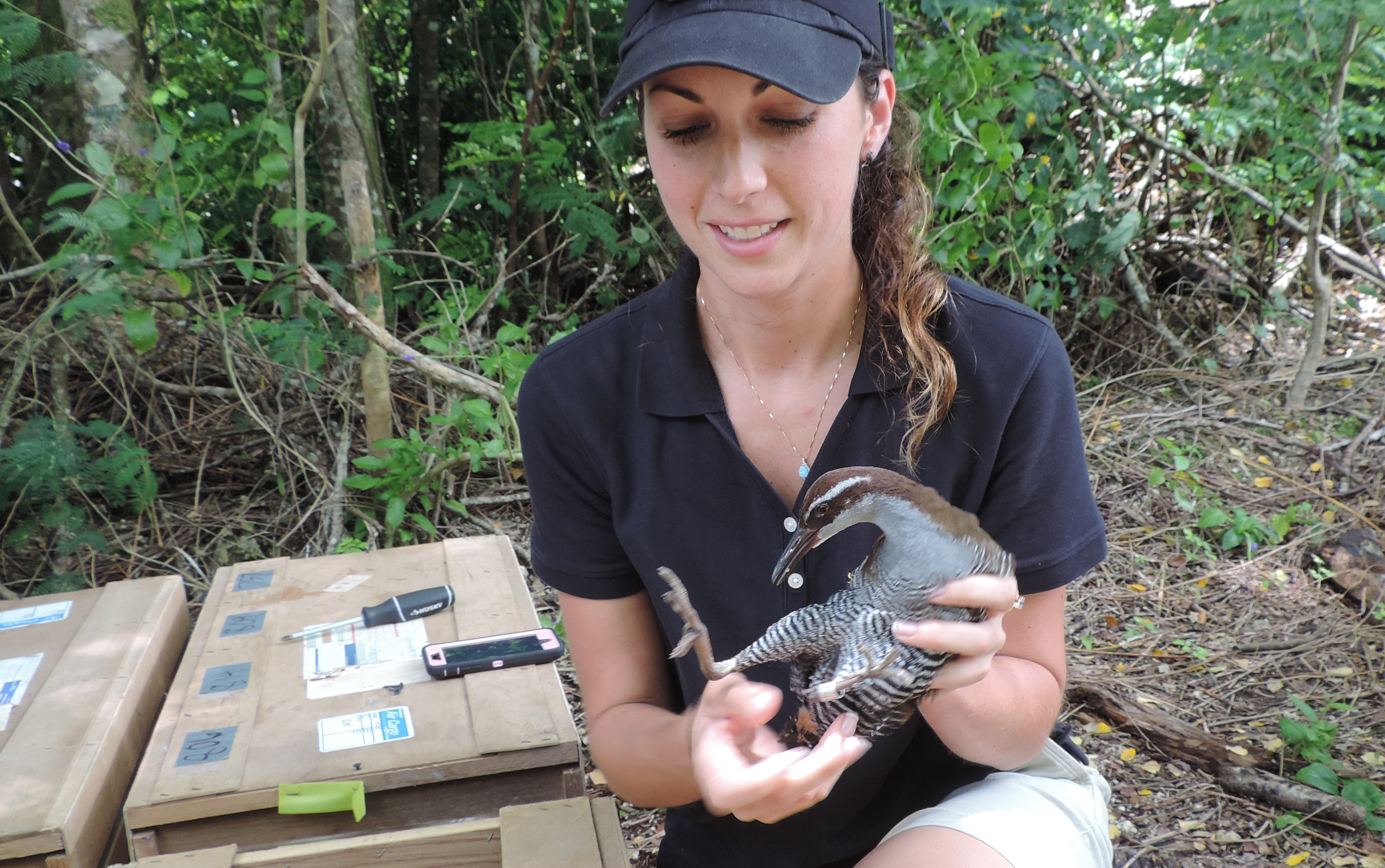 Keeper Erica Royer holding a Guam rail