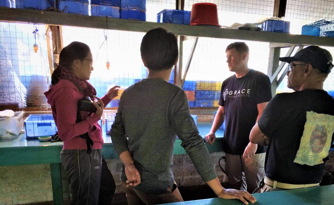 Matt Evans and colleagues in Myanmar discuss turtle husbandry. 