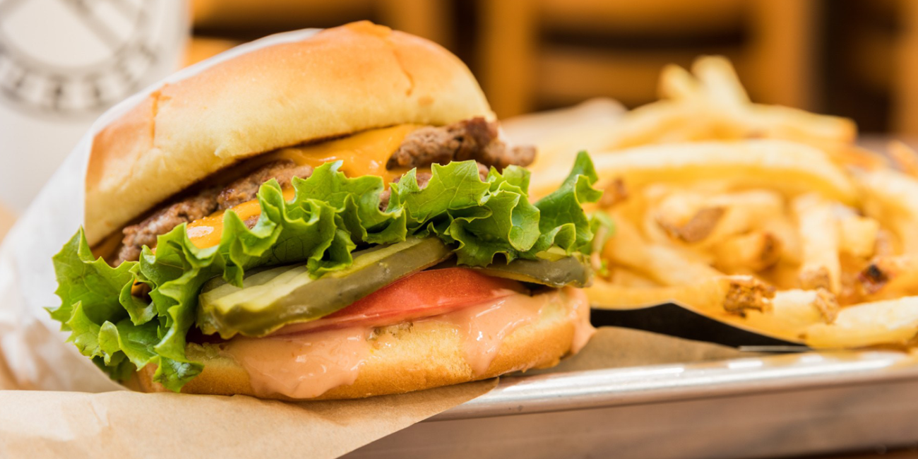 Photo of a cheeseburger with fries.