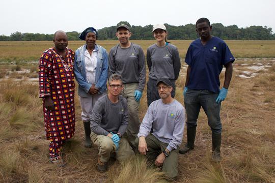 group poses in the field