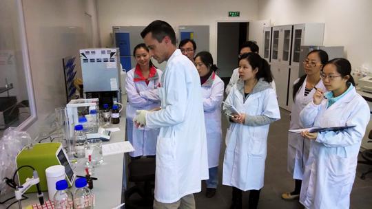 Dr. Kersey and trainees making assay buffer in the endocrine lab at CCRCGP