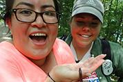 student delightedly holding a bug