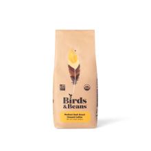 a coffee bag with a graphic illustration of a bird feather