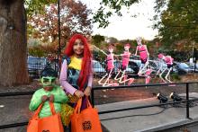 Boo at the Zoo. Costumed children standing in front of an exercising skeleton display.