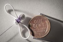 A 0.35 gram coded radio tag is about the same size as a penny.