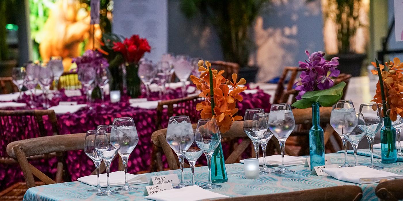 A table with linens, glasses and flowers at the Smithsonian's National Zoo's Monkey Business Gala