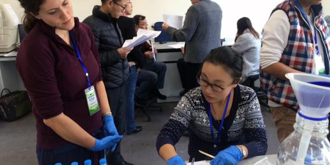 two female cientists look over data