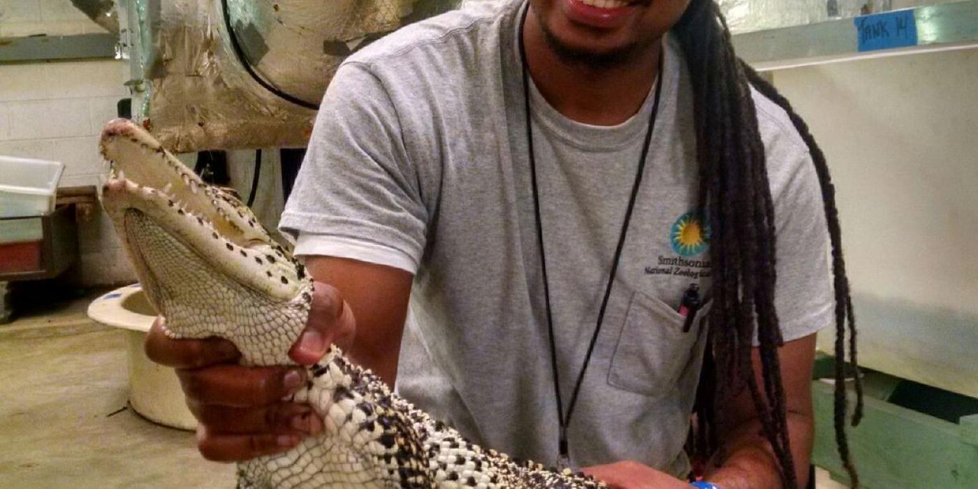 Kyle holds 4-year-old Cuban crocodile, Jésus